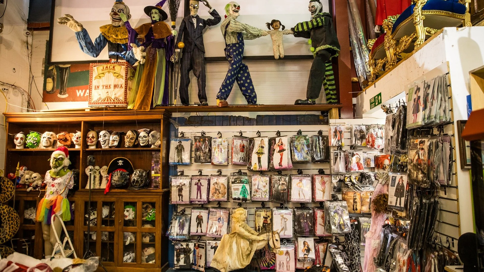 Halloween masks, costumes and props on display